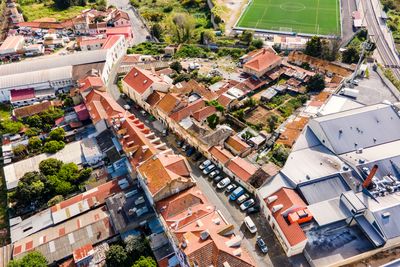 Aerial view of a small residential district in lisbon outskirt along a railway,, lisbon, portugal.