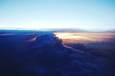 Scenic view of landscape against sky at sunset