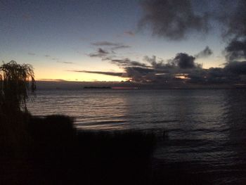 Scenic view of sea against sky at sunset