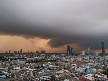 High angle view of buildings in city against sky