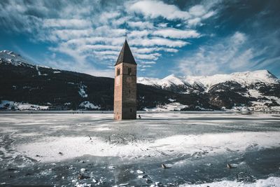 Building against cloudy sky during winter