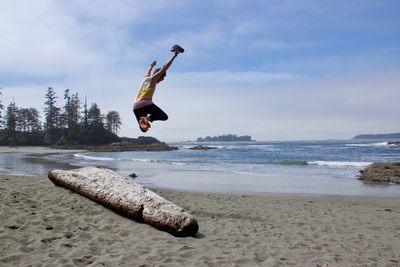 Man jumping on beach