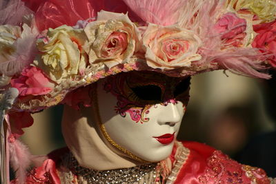 Close-up of woman wearing venetian mask