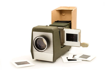 Close-up of camera over white background