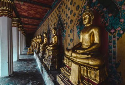 Statue in temple outside building