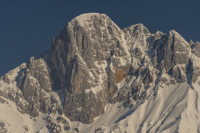 Scenic view of snowcapped mountains against clear sky