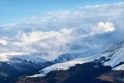 Scenic view of snowcapped mountains against sky