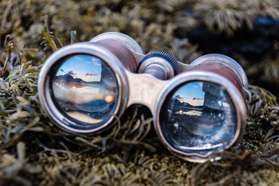 Close-up of binoculars on grass