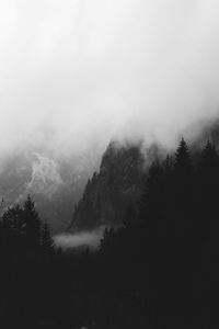Scenic view of mountains against sky during foggy weather