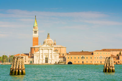 View of castle by sea against sky