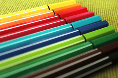 High angle view of multi colored drinking straws