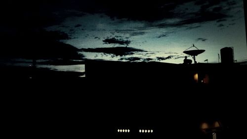 Low angle view of illuminated street light against sky at night