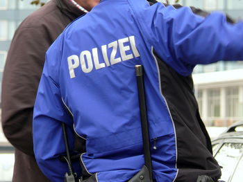 Midsection of police in uniform