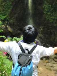 Rear view of woman on field