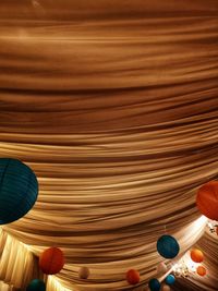 Low angle view of multi colored ball on table