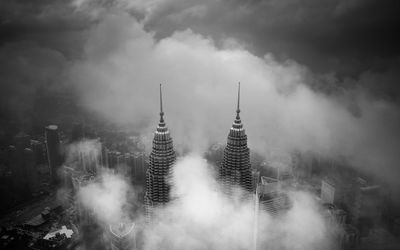 View of skyscrapers in foggy weather