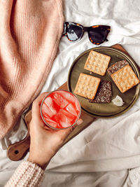 Midsection of woman holding food