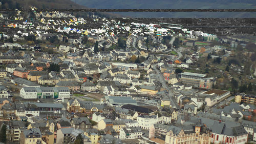 High angle shot of townscape against sea