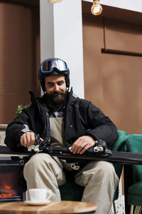 Rear view of man sitting in car