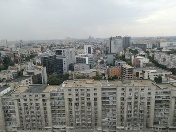 High angle view of buildings in city against sky