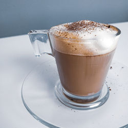 Close-up of coffee cup on table