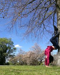 Full length of woman against trees against sky