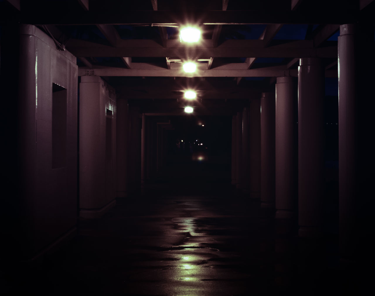 architecture, built structure, the way forward, illuminated, indoors, corridor, diminishing perspective, building, empty, lighting equipment, narrow, building exterior, light - natural phenomenon, sunlight, in a row, vanishing point, night, ceiling, no people, door