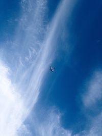 Low angle view of airplane flying in sky