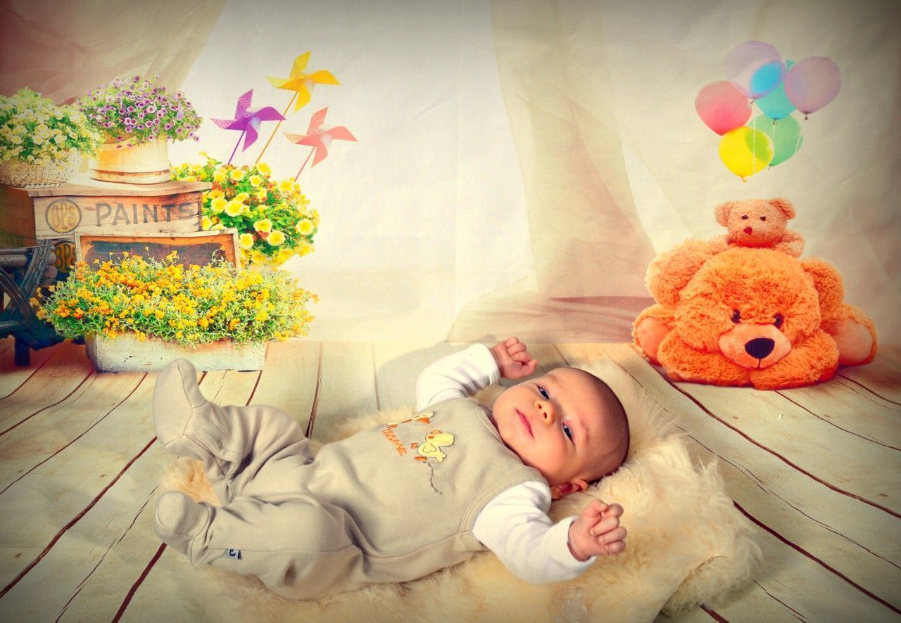 CUTE BOY SLEEPING WITH FLOWERS IN THE BED