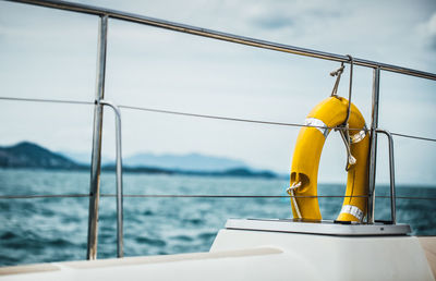 Low section of woman standing in boat