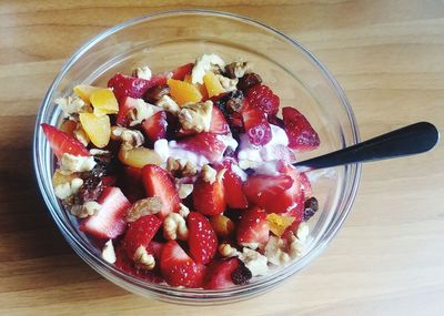 High angle view of chopped fruits in bowl on table