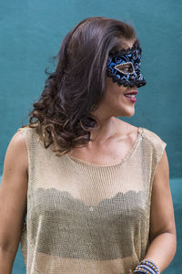 Portrait of a woman wearing venice carnival mask. 