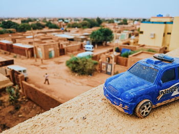 Close-up of toy car outside building