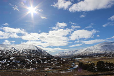 Scenic view of mountains against sky during winter