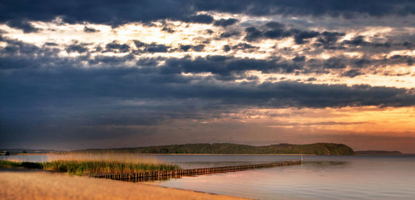Scenic view of sea against dramatic sky