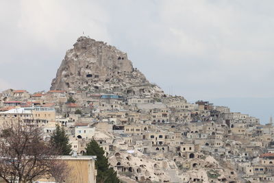 Buildings in city against sky