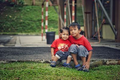 Boy sitting outdoors