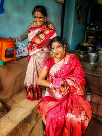Portrait of woman standing in traditional clothing