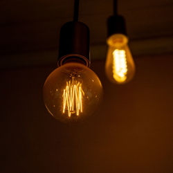 Close-up of illuminated light bulb