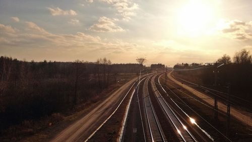 High angle view of railroad tracks against sky during sunset