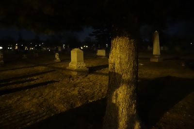 Illuminated lights against sky at night