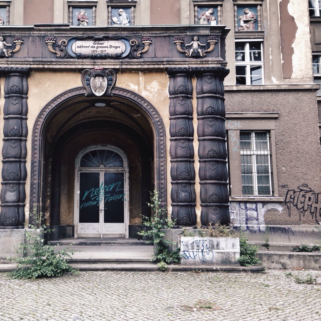 building exterior, architecture, built structure, window, building, facade, city, door, arch, entrance, residential building, outdoors, day, street, residential structure, no people, old, exterior, history, brick wall