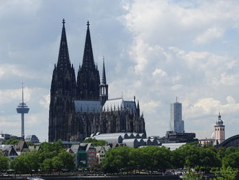 Buildings in city against sky