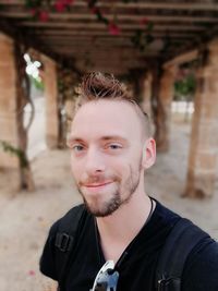 Close-up portrait of smiling handsome man