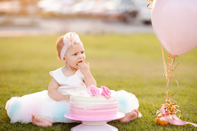 Portrait of boy playing with balloons