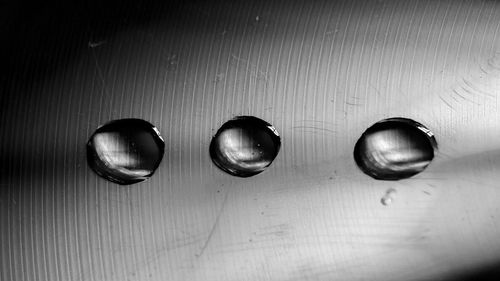 High angle view of water drops on metal