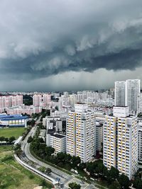 High angle view of street amidst buildings against sky