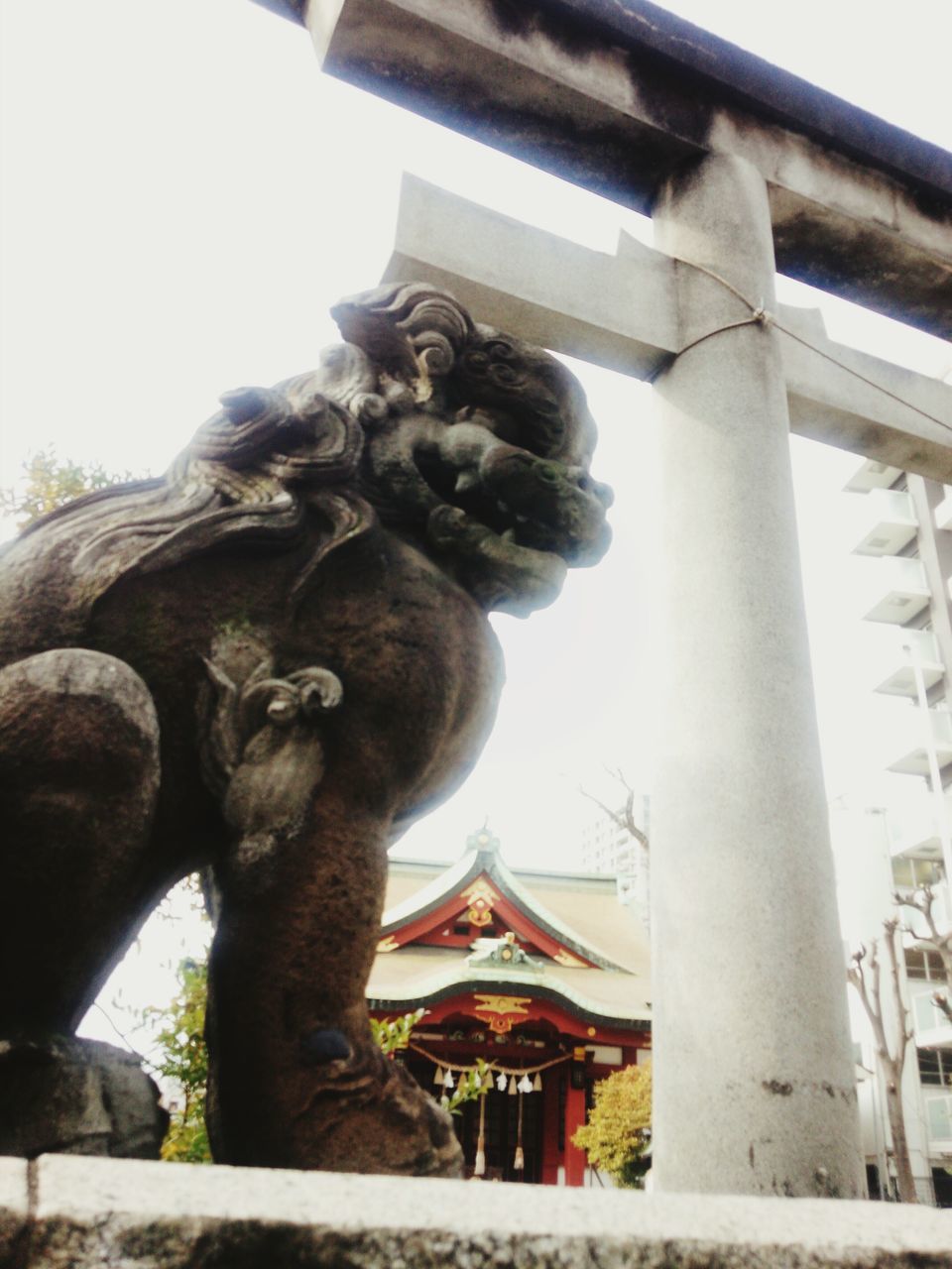 statue, sculpture, human representation, art and craft, art, creativity, animal representation, clear sky, low angle view, built structure, architecture, carving - craft product, craft, no people, building exterior, day, religion, stone material