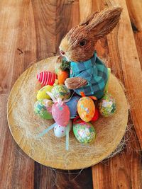 Multi colored easter eggs on wooden table