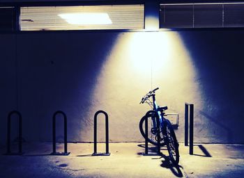 Bicycle parked against wall